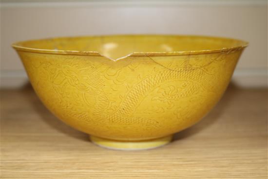 A Chinese yellow ground bowl (a.f.)and two blue and white dishes 19cm. & 16cm.